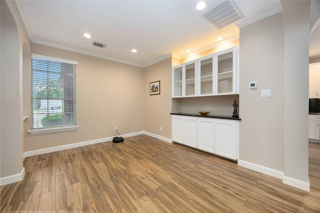 The formal dining room features a custom built in for added storage.