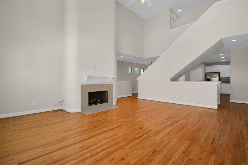 The living room connects to the kitchen and dining room.