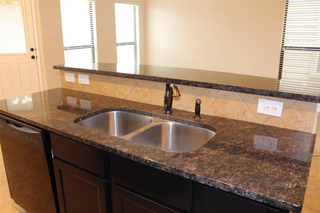 Stylish breakfast bar with a sleek undermount sink.