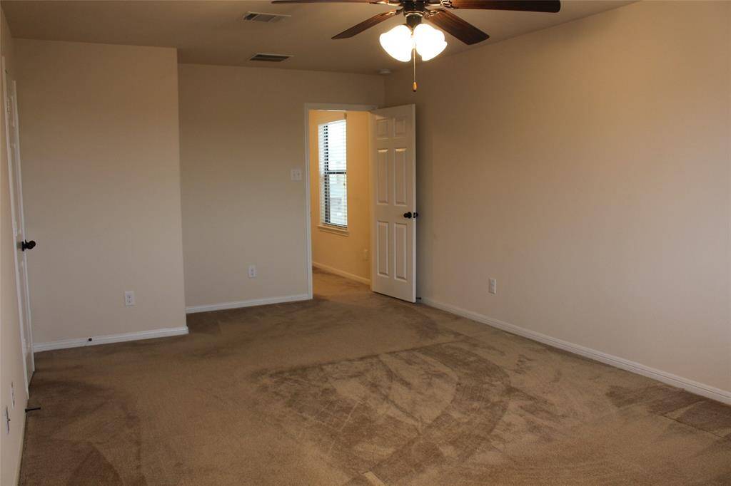 Another view of the primary bedroom