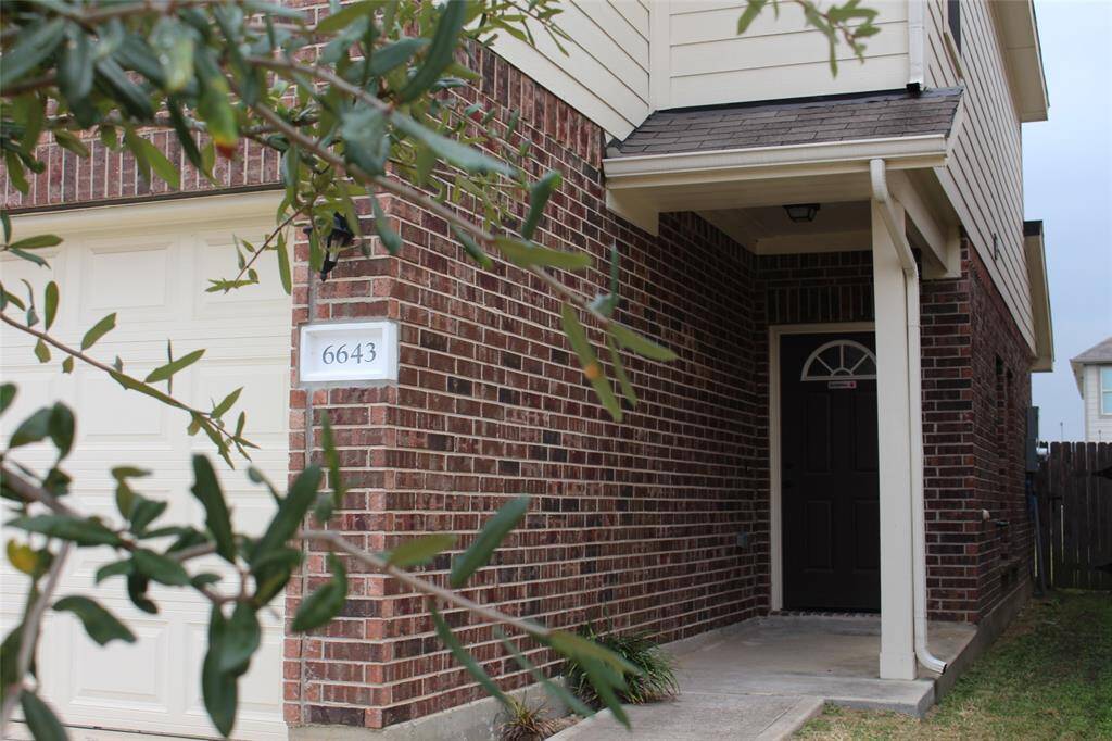 Welcoming entrance with a covered porch. The