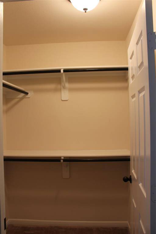Expansive walk-in closet in the secondary bedroom.