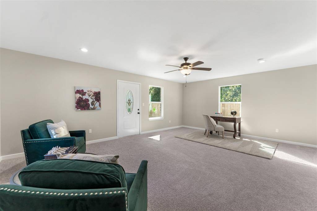 This light filled space also has direct access to the covered back porch and green space.