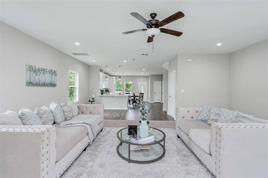 Imagine the memories you will make in this lovely entertaining space! Neutral gray walls and recessed lighting only add to the enormous and open 2nd floor living area! Beautiful natural light creates an refreshing and airy feel!