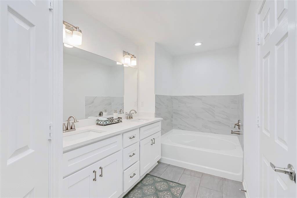 The primary suite is tucked away on the third floor, and provides a calming and relaxing experience. Neutral gray walls and plush fresh carpeting allow all your worries to melt away.