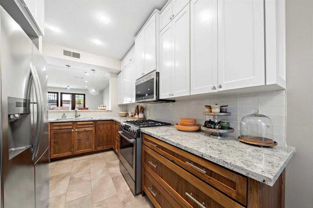 Gorgeous fully renovated kitchen with custom cabinetry.