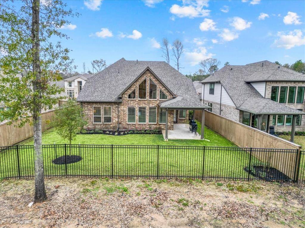 This charming home features a spacious backyard with a well-maintained lawn and a covered patio, perfect for outdoor activities and relaxation. The four-sided brick exterior adds a classic touch, and the property is enclosed with a secure fence, ensuring privacy. There is a green space behind this property for a little extra benefit.