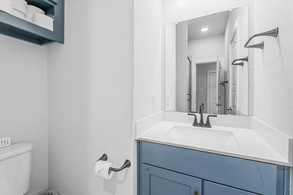 Full bath downstairs with access to a bedroom.