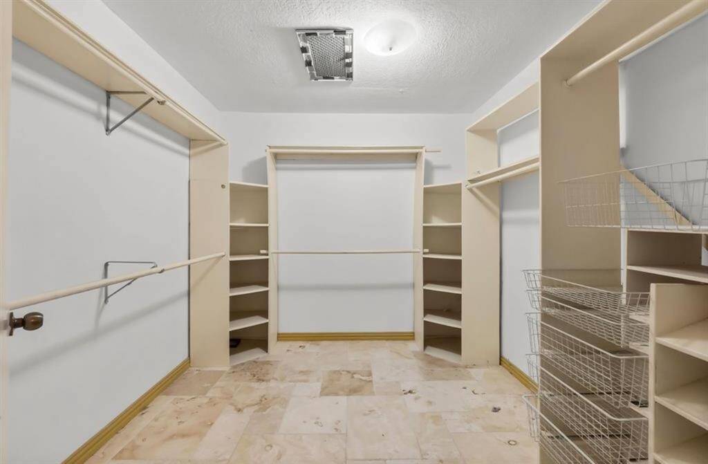 A spacious custom closet offers a space, so everything will have its place!