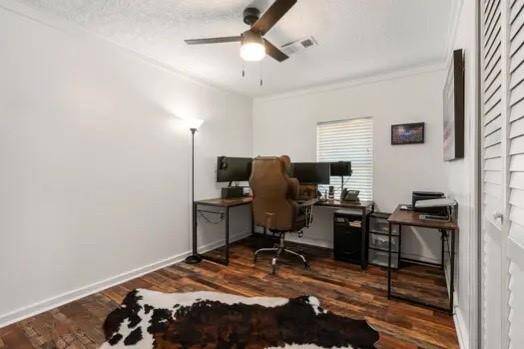 This secondary bedroom is currently being used as a home office!  Neutral tones, crown molding and more of the beautiful laminate flooring finishes out the space!