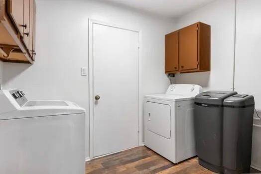 This utility room has cabinets for storage and quick access to the garage!