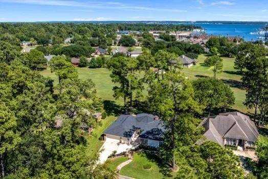 This aerial view shows you the proximity to the lake and tons of summer fun!  There are so many things you can't see with photos: Foundation repair with lifetime warranty, generator outlet/mechanical transfer switch, an A/C unit replaced in 2023, and roof maintenance done in 2024!