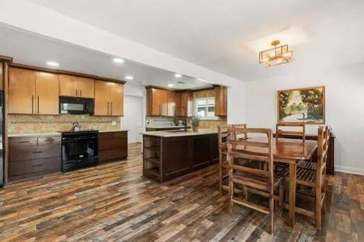 This kitchen offers tons of storage with the dual tone cabinets featuring cabinets and drawers for storage!