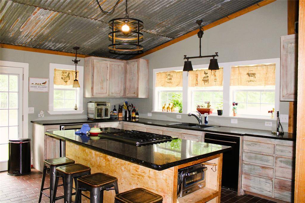 Natural lighting brings beauty to this farm kitchen