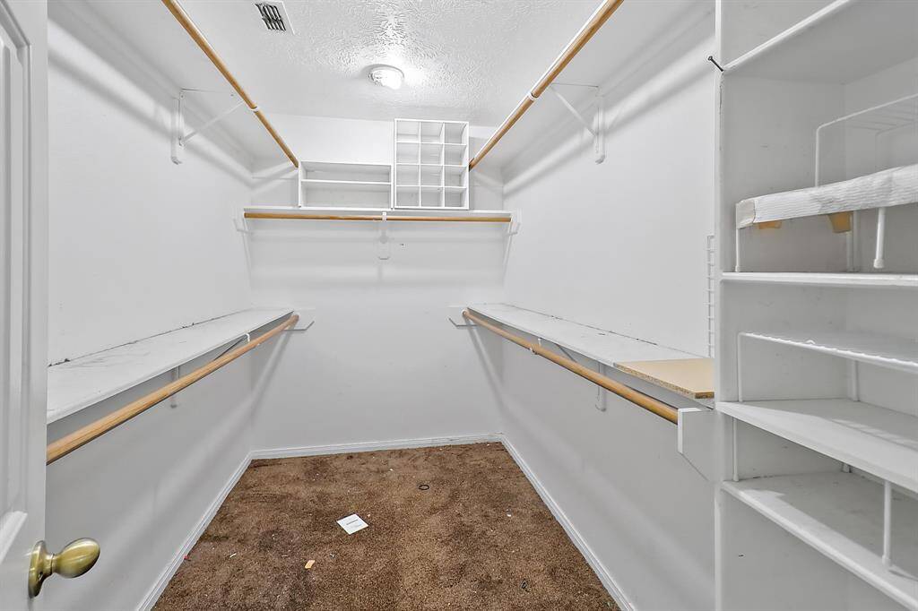 Large walk in closet in primary bedroom