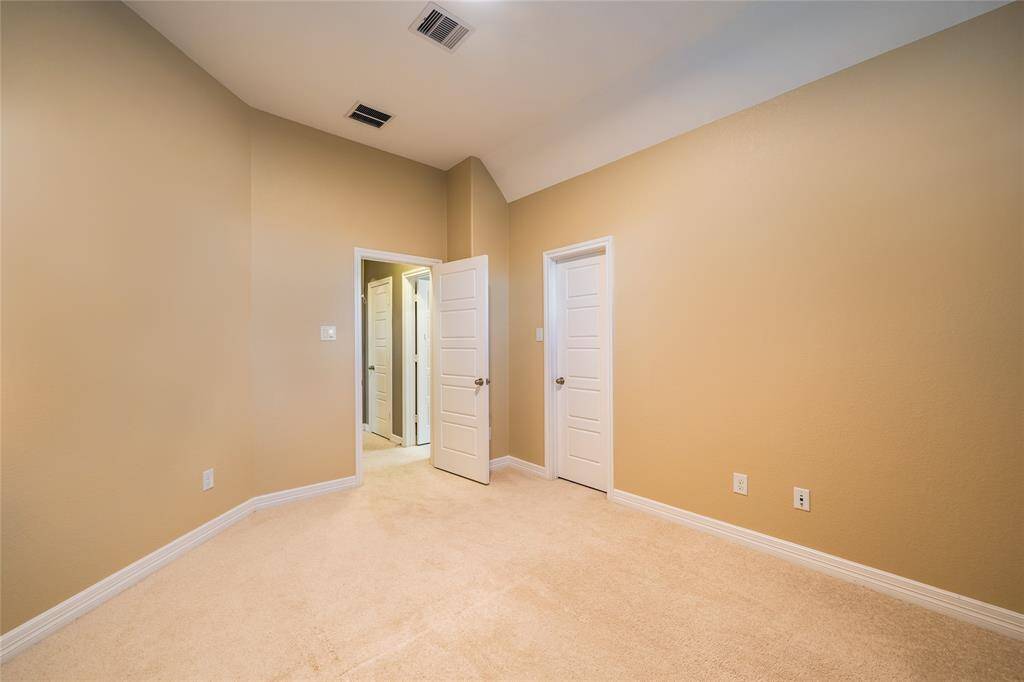 Bedroom 2 with a walk-in closet.