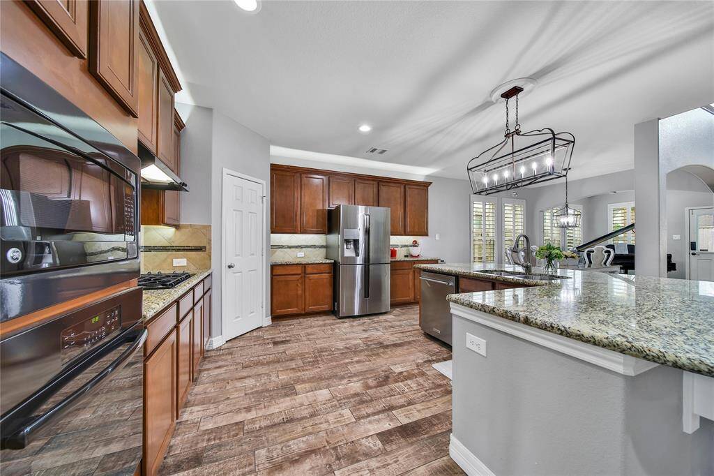 Cabinets galore on both walls of this chef's kitchen!