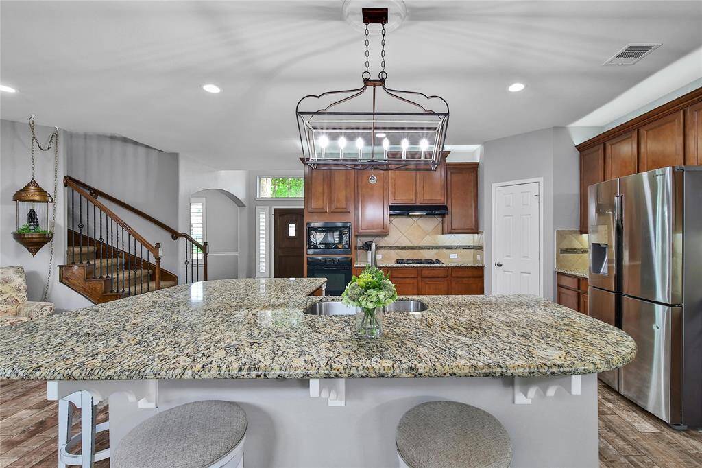 The island is placed perfectly to see the family room, breakfast and sunroom!