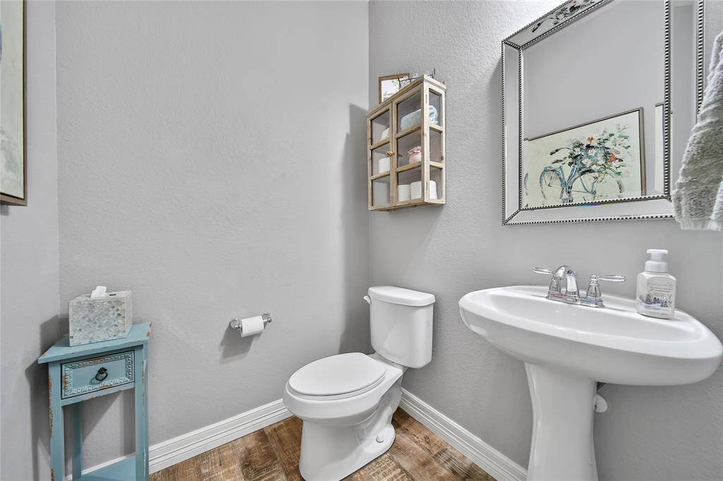 Convenient half bath located across from the laundry room, as you come in from the 3 car tandem garage.