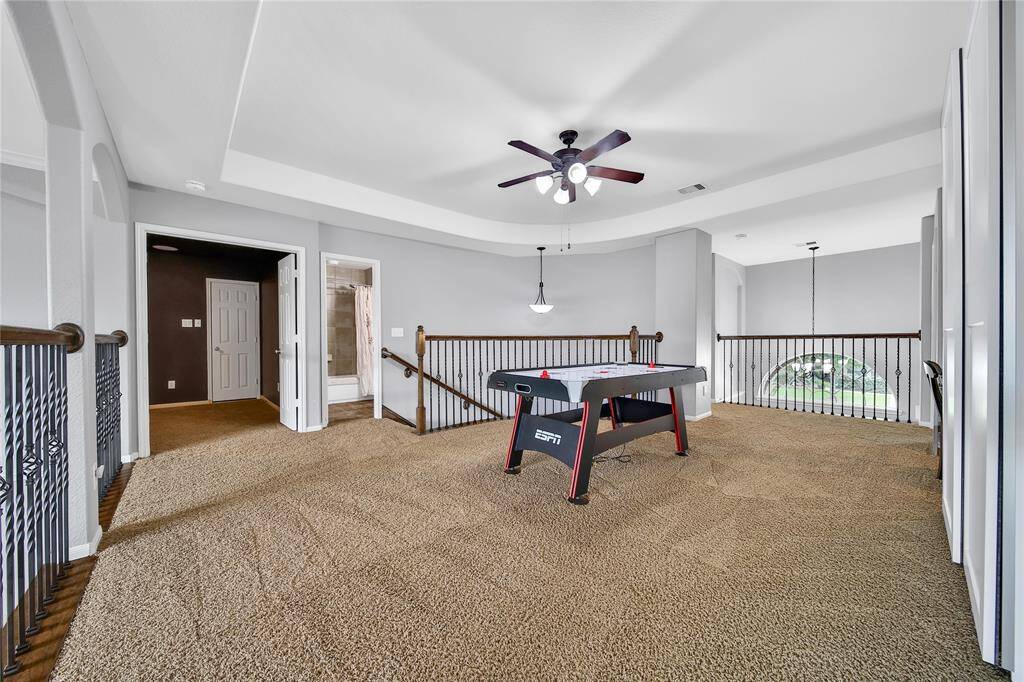 Media room upper right corner of this lofted game-room space