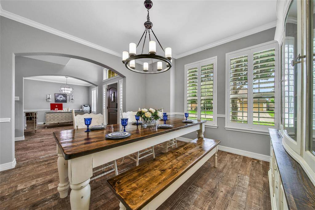 Upon entry, the formal dining with plantation shutters is on the left. This space could also be used as additional flex space as you need it.