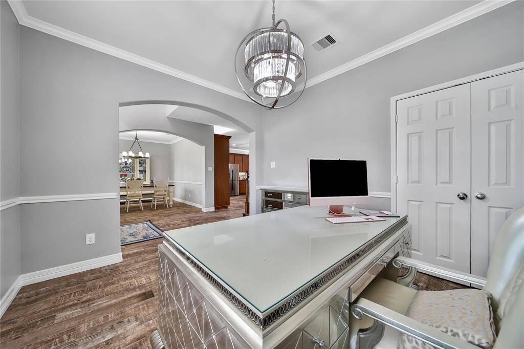 Across from the formal dining is the formal living area, currently used as a spacious home office with a closet for storing most all items!