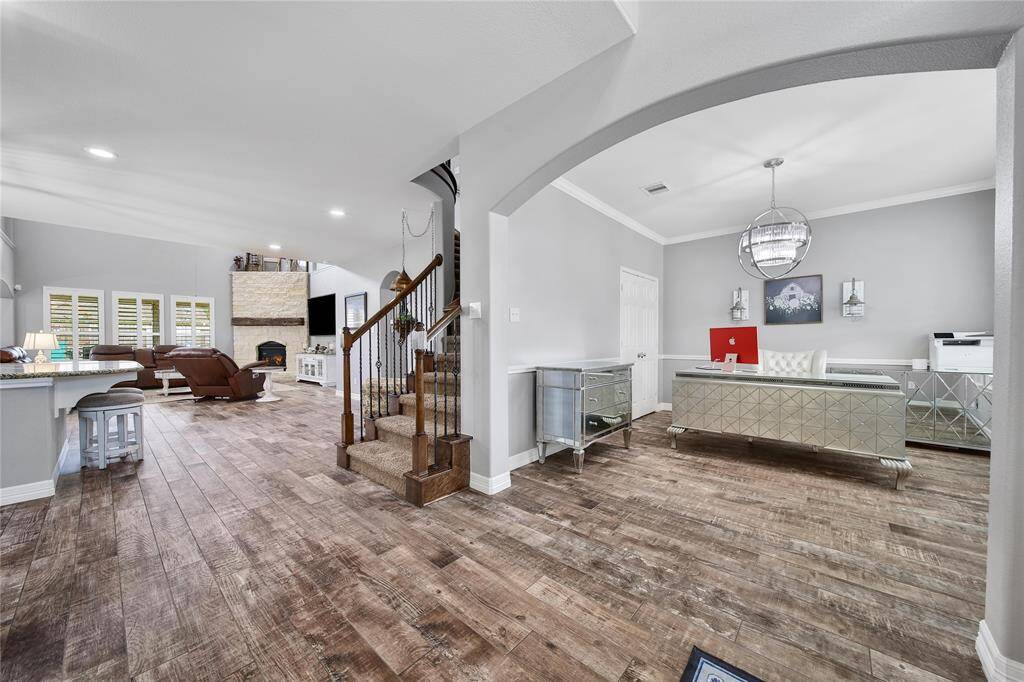 Just past the staircase, the kitchen is on the left and the family room is straight ahead!