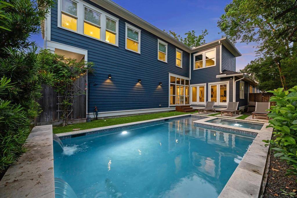 The stunning backyard with a pool, spa and screened-in porch also allows for indoor entertaining to flow to the outdoors and can be enjoyed year-round!
