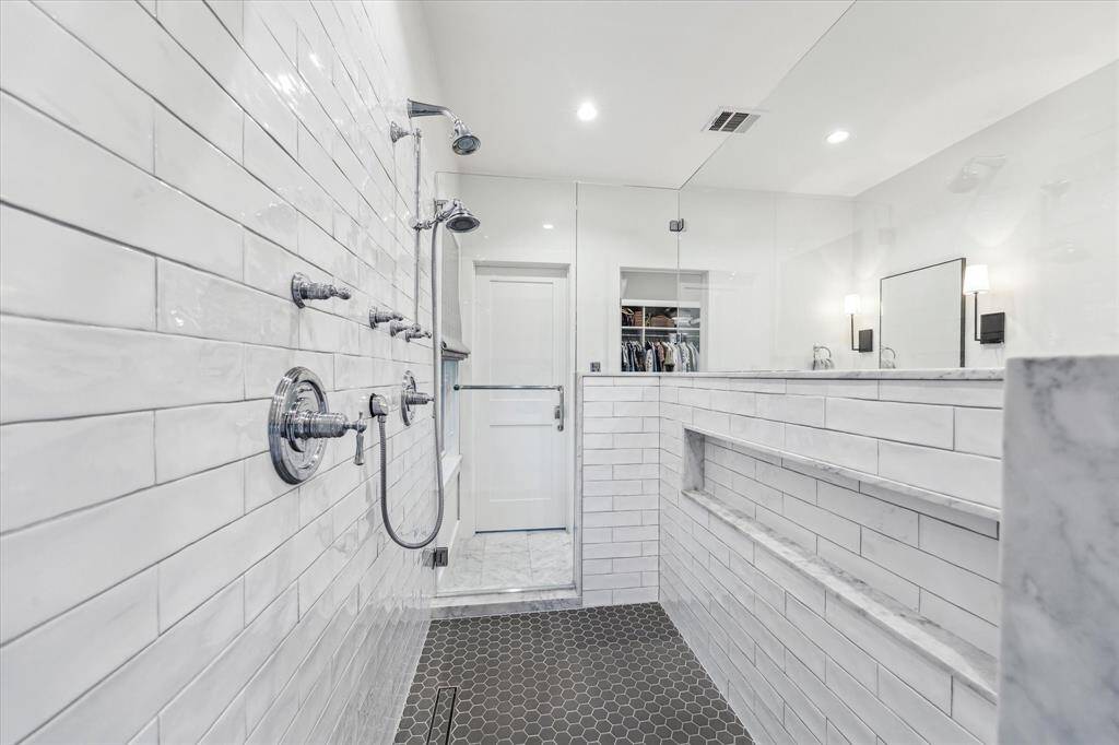 You’ll love beginning and ending your day in this luxurious double shower, featuring dual doors and twin shower heads for a truly spa-like experience.