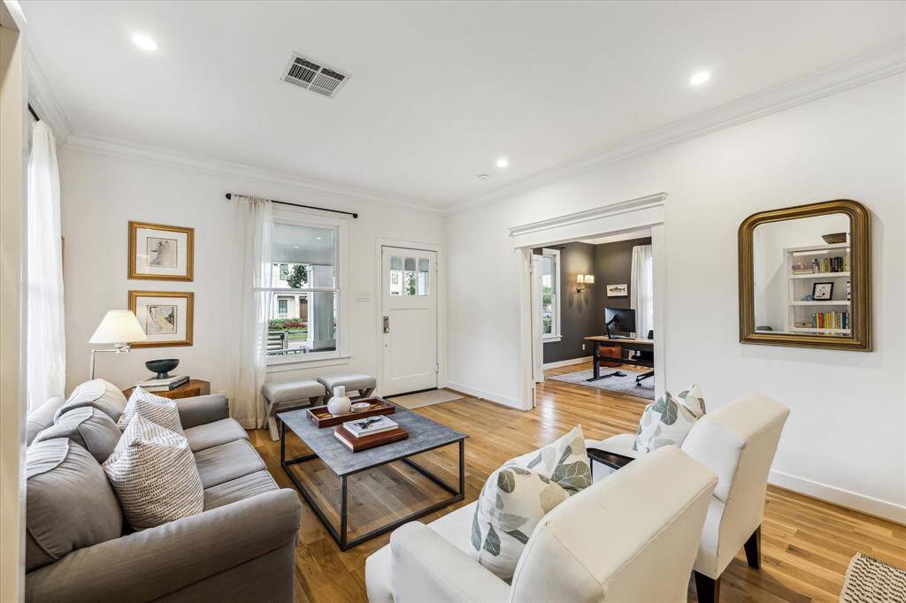 Step inside to discover stunning 3” white oak hardwood floors throughout and be pleasantly surprised by how spacious this bungalow truly is—far more than it appears from the outside!