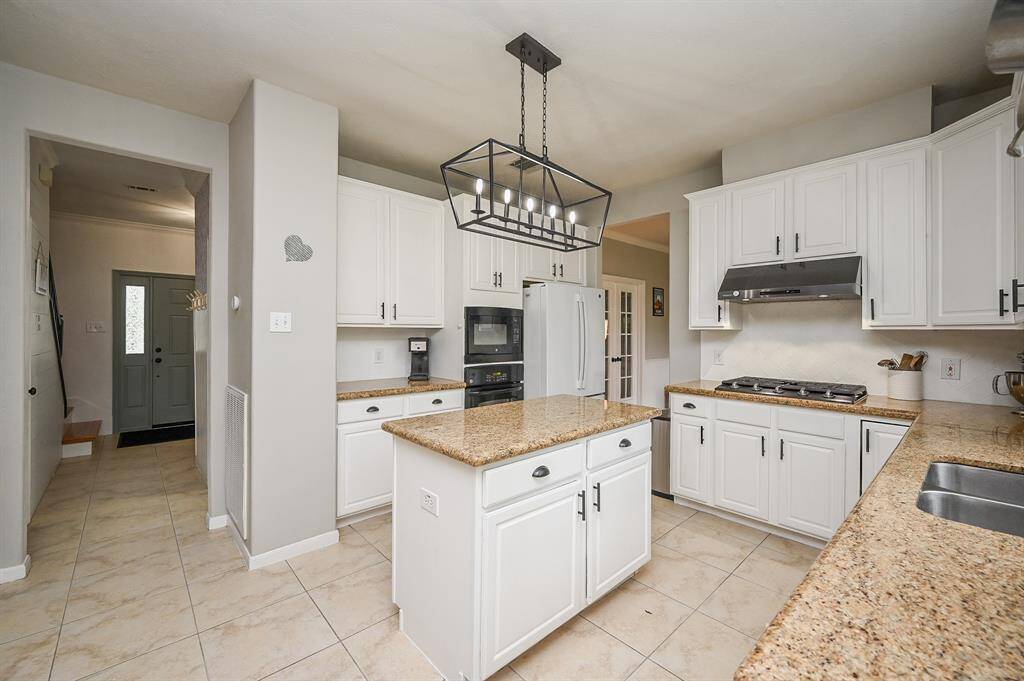 Updated lighting is seen throughout the home