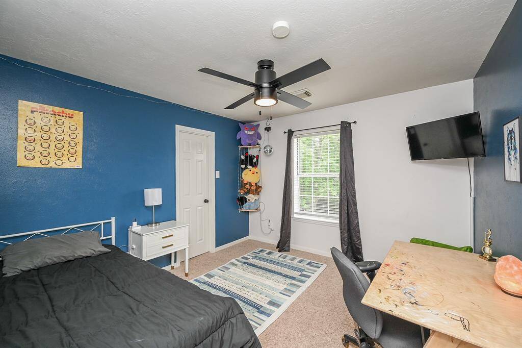 Large bright windows in the secondary bedroom