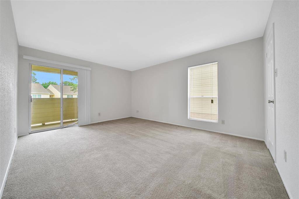Primary bedroom with primary balcony access.