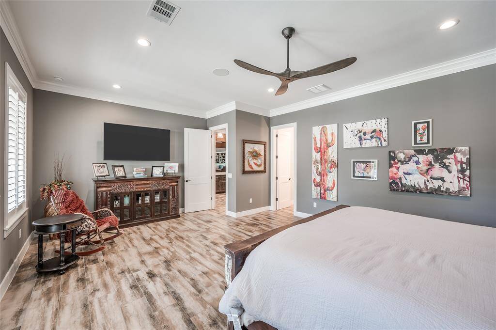 Another view of the primary bedroom suite.