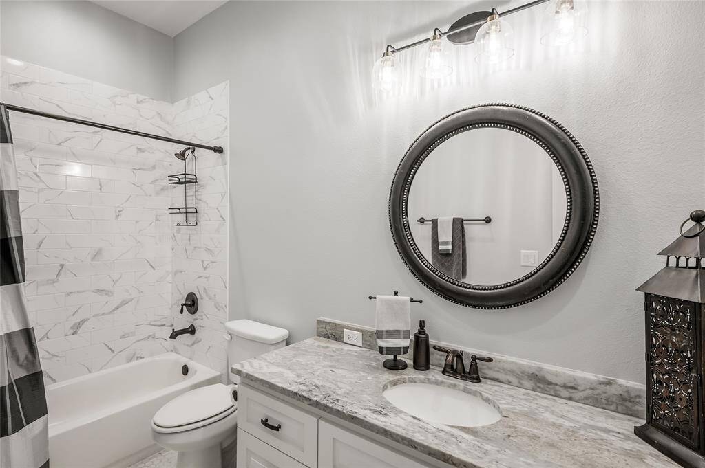 Leathered granite tops with custom tile surround.