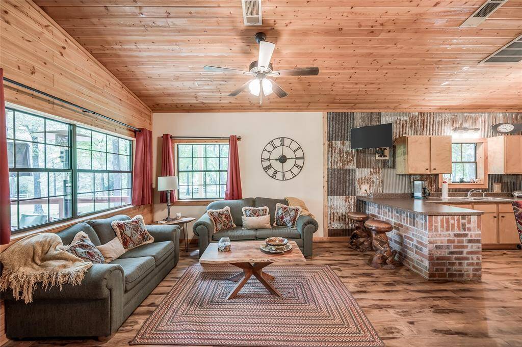 The living room with views of the private boat dock and lake.