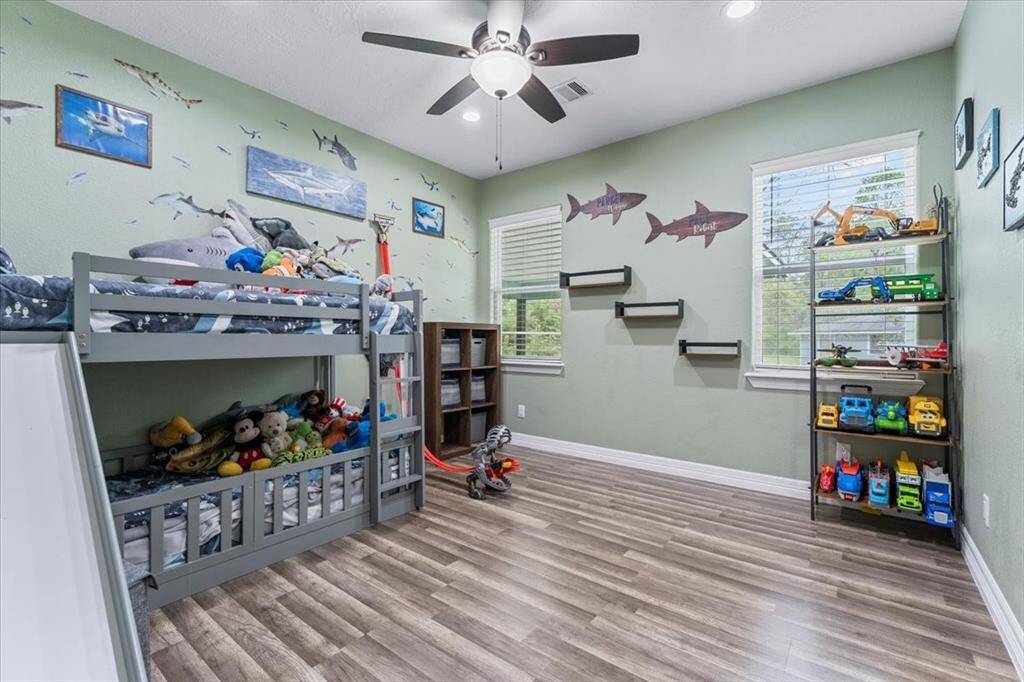 Sure! Here's a more polished version for a home sale listing:One of two bright and spacious secondary bedrooms, filled with natural light and plenty of room for furniture.