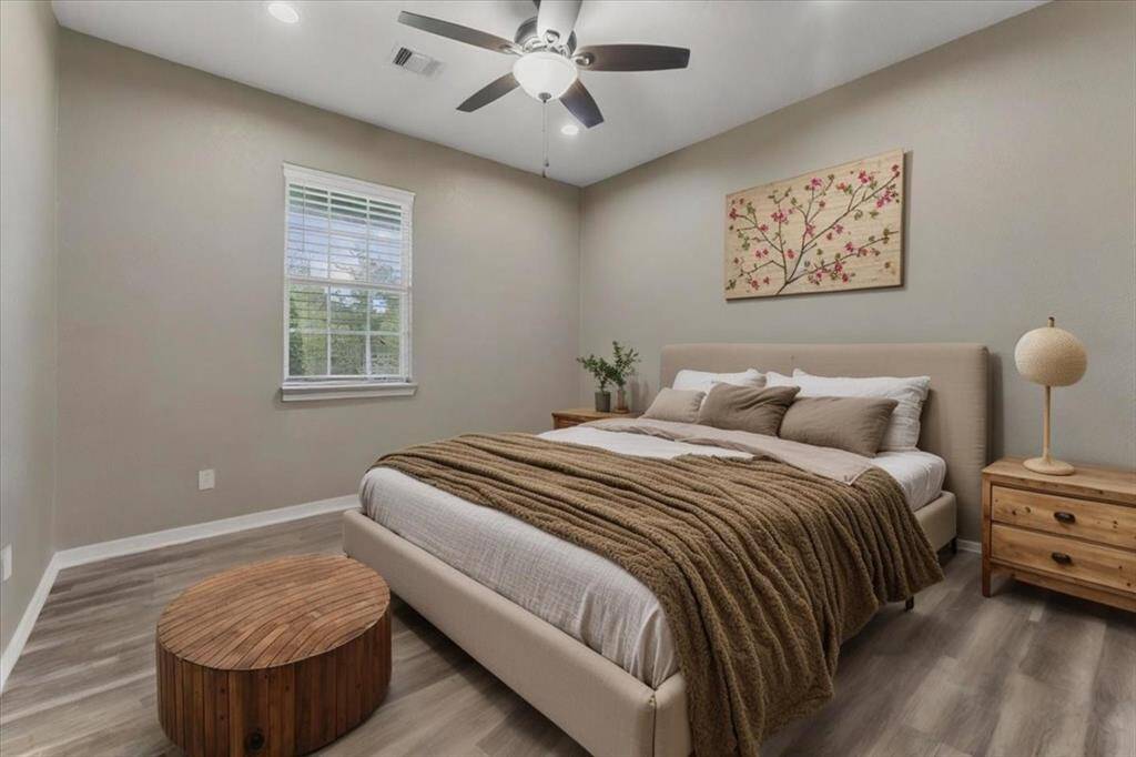 A third bedroom is located at the front of the home, offering great natural light and a quiet, private retreat.