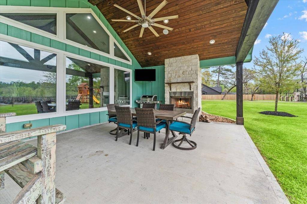 This outdoor area is perfect for gatherings or enjoying dinner on the patio. On cool evenings, stay warm with the fireplace while watch a sports game.