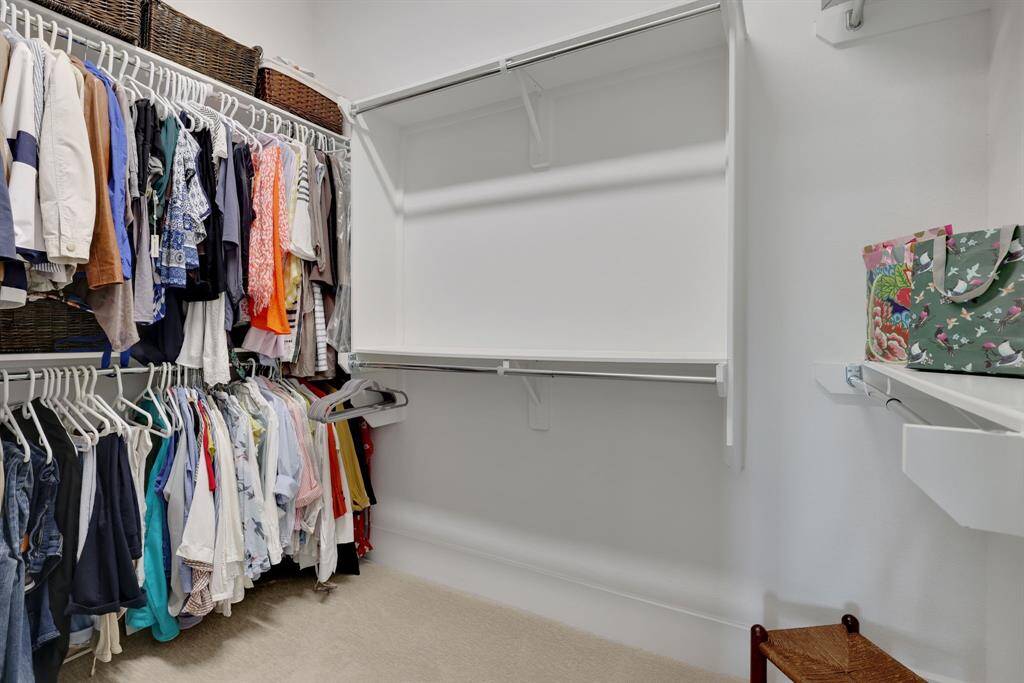 One of the closets in the primary with built-in shelving.