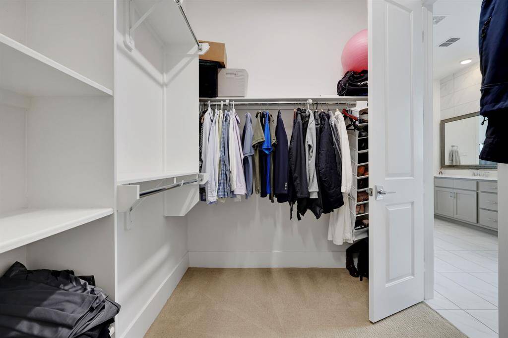 The second closet also offers built in shelving and lots of space.