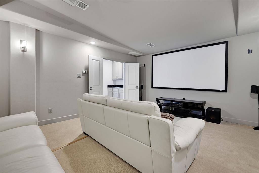 The media room will be perfect for those at home movie nights and offers a bar conveniently located next to it.