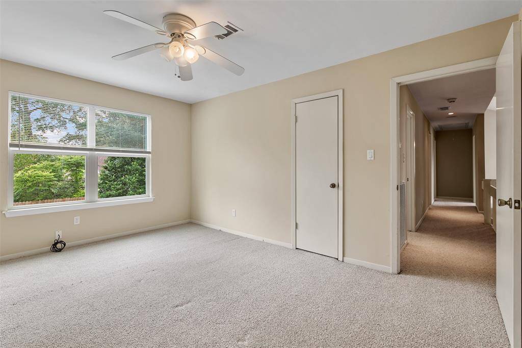 Additional view of the secondary bedroom upstairs which is at the end of the hallway.