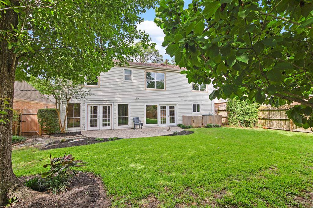 View of the back elevation of home and patio area.