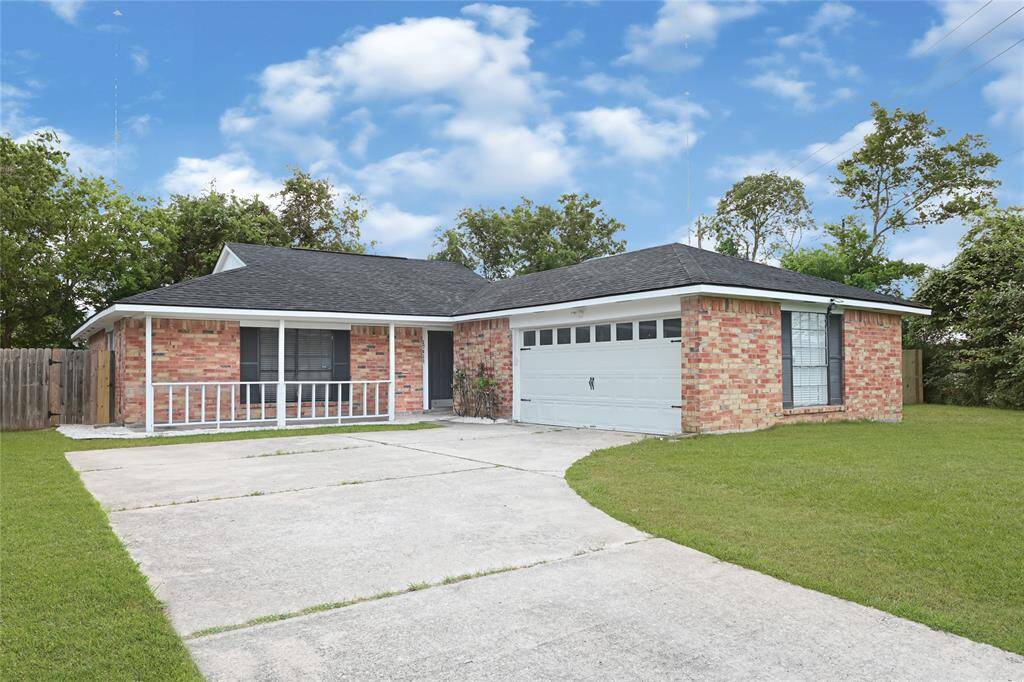 Classic brick exterior with a curved driveway.