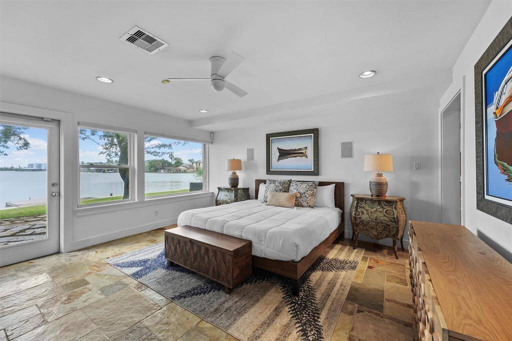 A serene retreat with panoramic lake views and direct access to the outdoors.