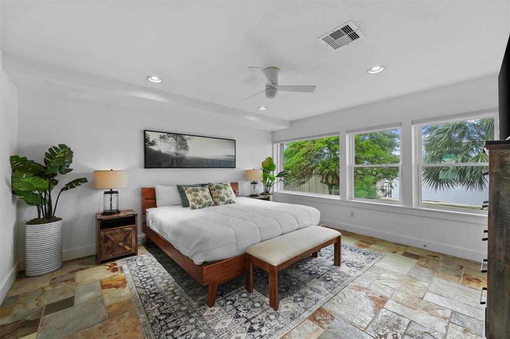 Bask in natural light with stunning views of lush greenery and water views, creating a peaceful retreat right outside your window.