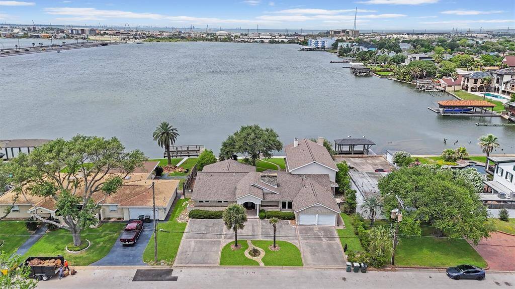 This overhead shot showcases the expansive layout of the property, with its prime waterfront location offering direct access to serene water views.