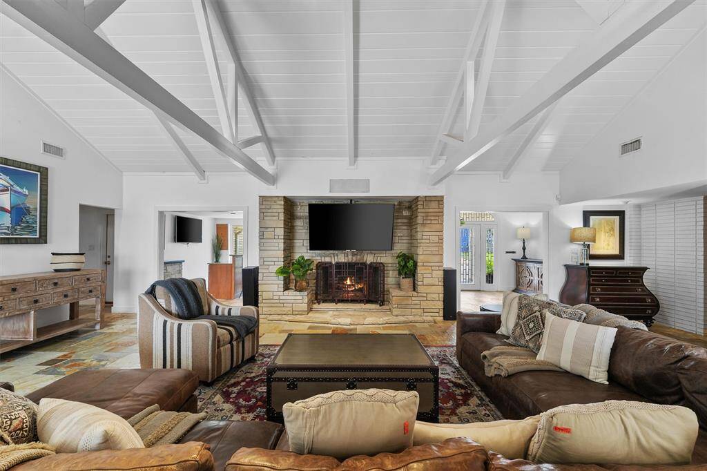 A fresh angle on the living room highlights its balanced design, generous seating, and open flow—ideal for effortless entertaining.