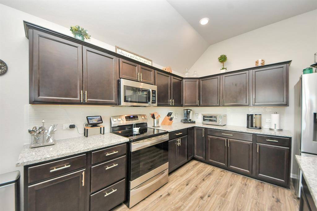 Granite countertops and subway tile backsplash.